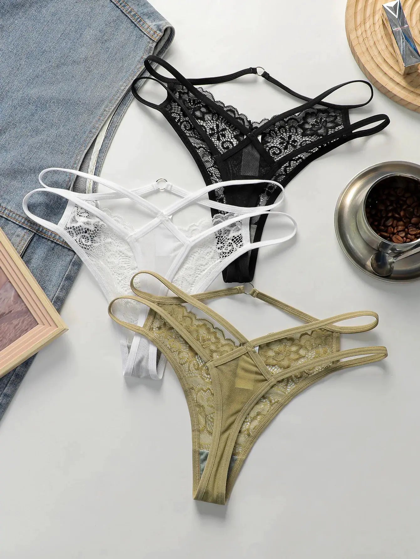3-pack lace thongs in black, white and beige by Simples Market; floral lace design.