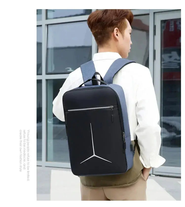 Anti-theft laptop backpack by Simples Market, black hard-shell front with gray fabric sides