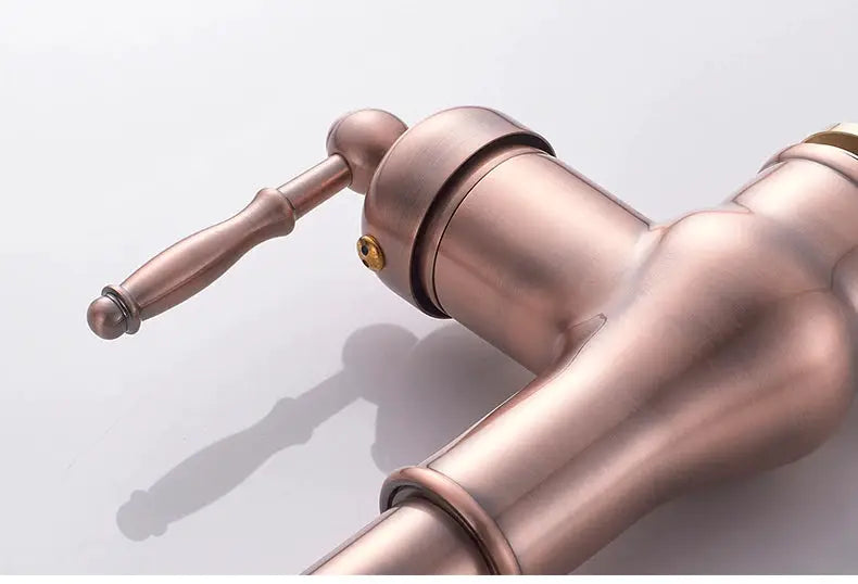 Kitchen faucet in antique bronze with pull-out sprayer and lever handle.