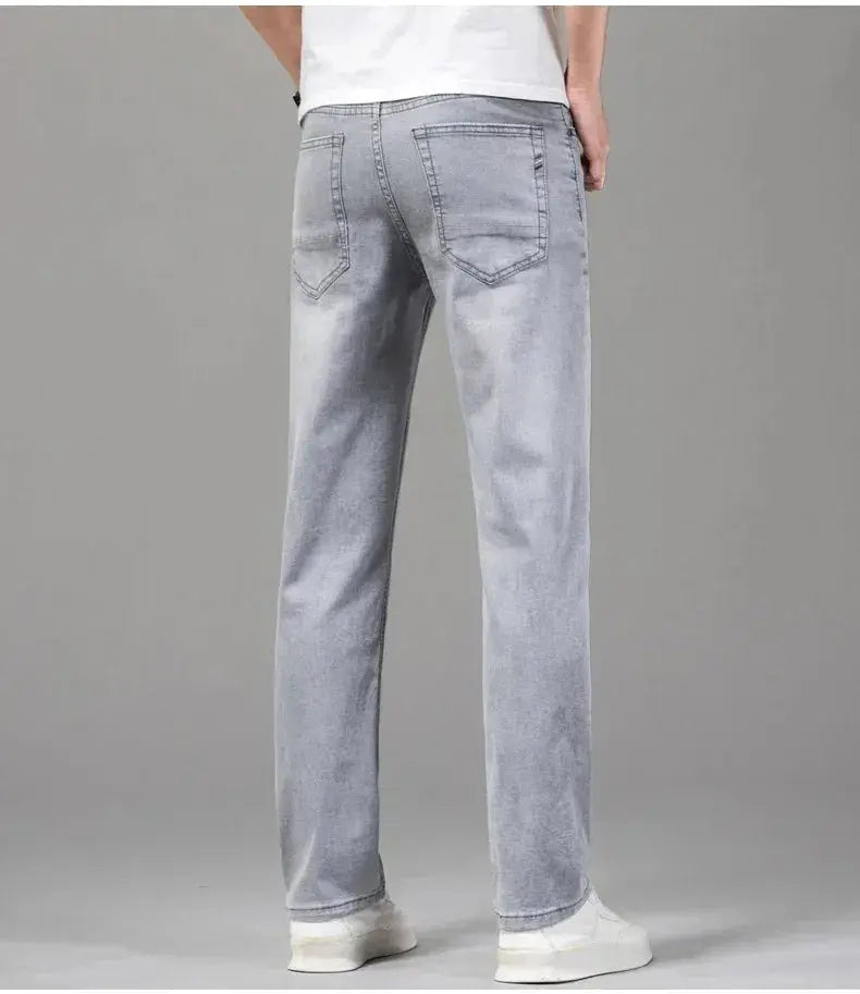 Men's gray stretch denim jeans with back pockets, straight-leg fit