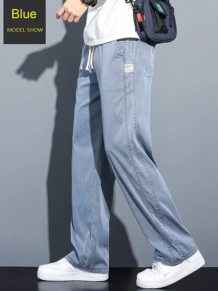 Blue men's lyocell jeans with drawstring elastic waist, thin loose straight fit