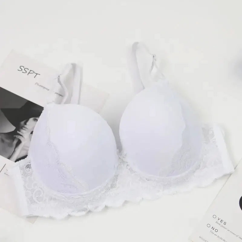 White lace push-up bra with molded cups and scalloped trim, shown with SSPT packaging cards