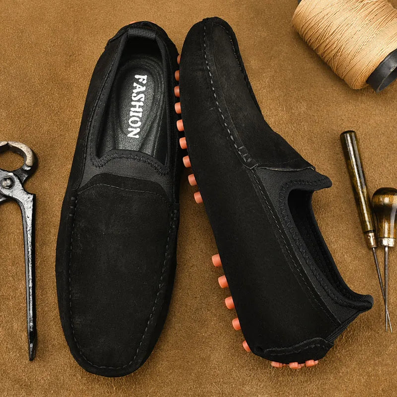 Men's driving shoes in black suede with orange studded outsole for casual wear