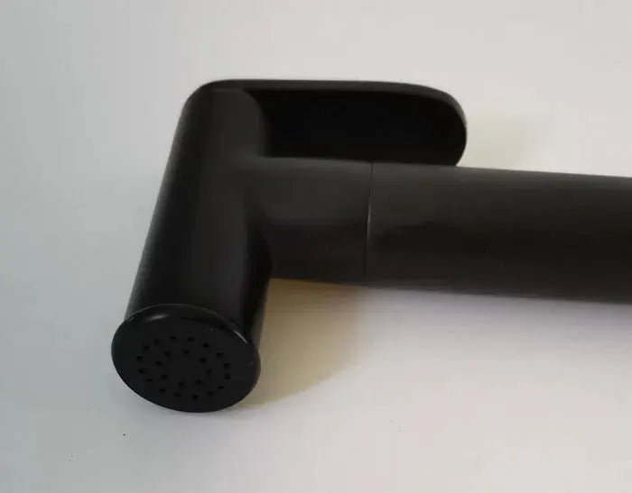 Black handheld bidet shower head with perforated nozzle and curved handle