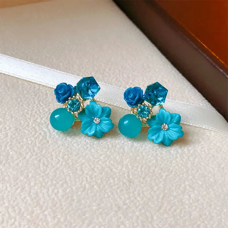 Turquoise flower earrings with geometric crystal studs and gold-tone settings
