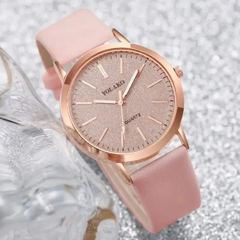 Women's rose-gold-tone watch with pink leather strap and glitter dial, quartz movement