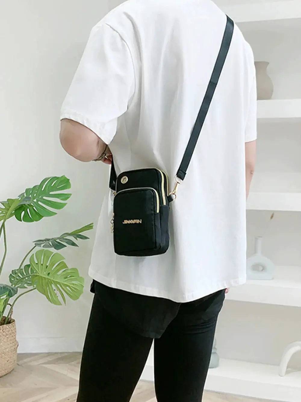Mobile Phone Crossbody Bag, black mini bag with gold-tone hardware and front pocket