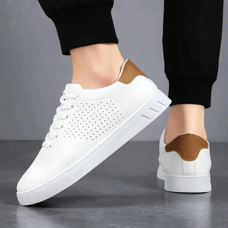 Men's white leather sneakers with perforated side panels, lace-up closure, brown heel patch, white sole