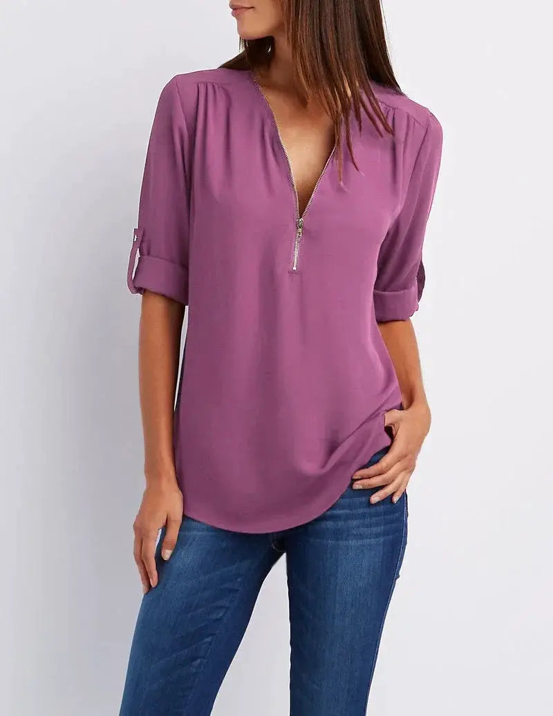 Women's chiffon blouse in purple with deep V-neck zip-front, rolled sleeves, loose fit.