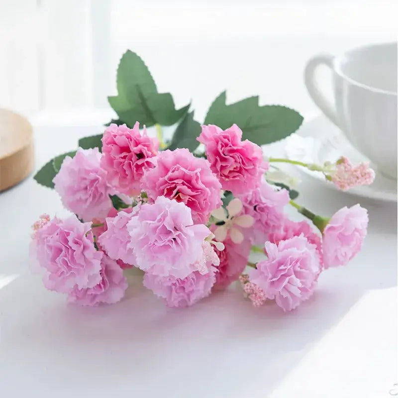 Pink artificial carnations bouquet with green leaves by Simples Market