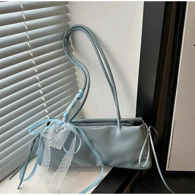 Square shoulder bag Simples Market, light-blue PU with lace bow decoration