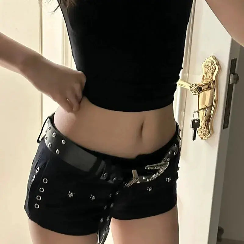 Simples Market black denim shorts with studs and belt.