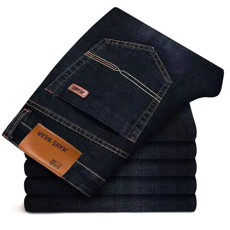 Men's dark blue denim jeans stacked in six pairs, Simples Market with leather patch and contrast stitching