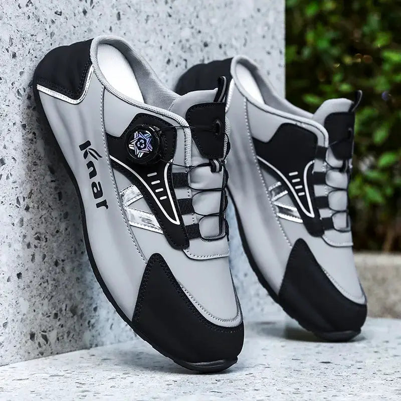 Men's grey and black lightweight sneakers with lace-up design and padded collar