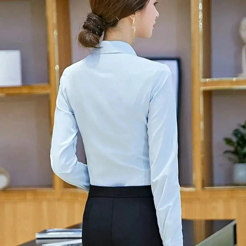 Simples Market light blue women's long-sleeve blouse, solid office-ready style