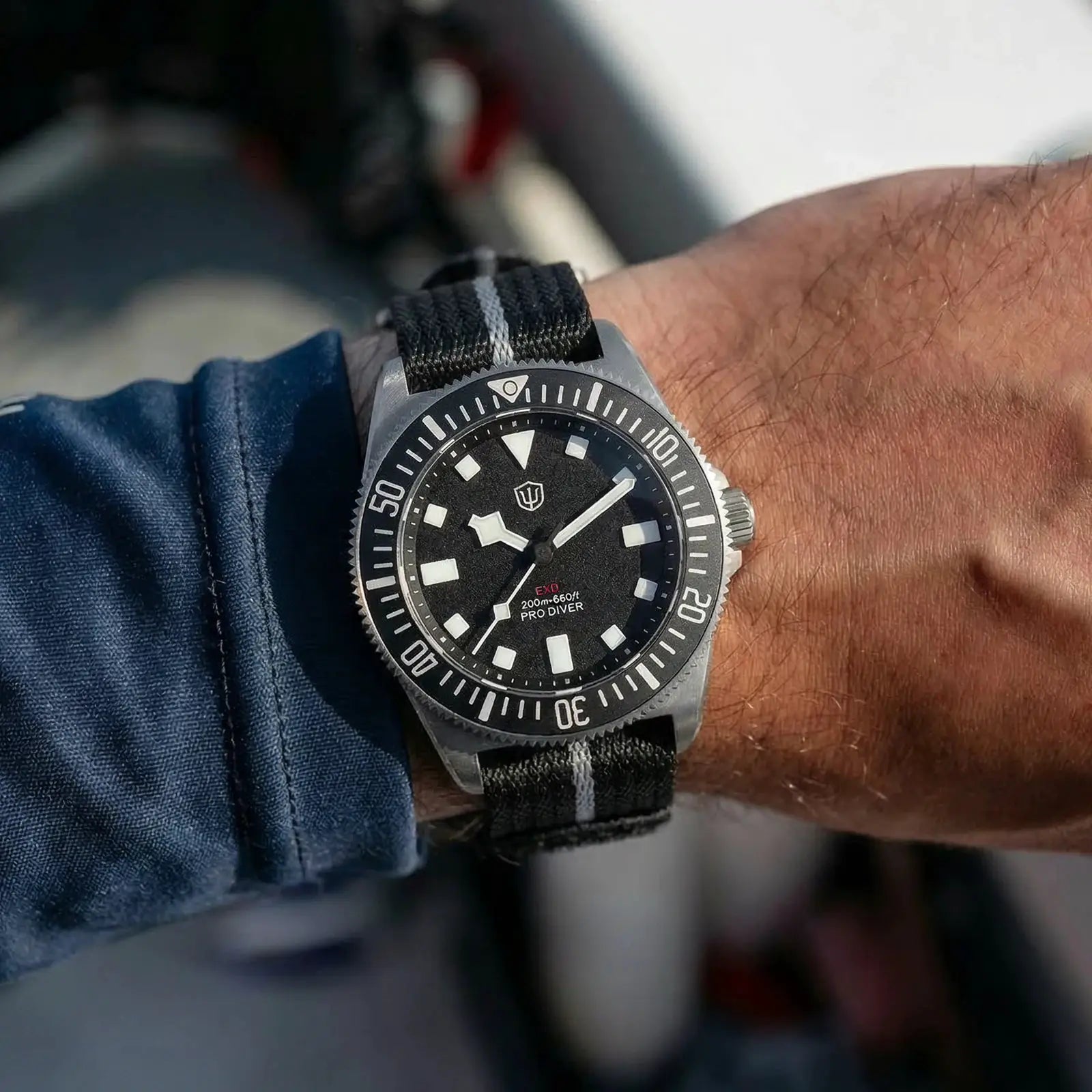 Watchdives EXD 40mm dive watch on black nylon strap with white stripe, black dial, 200m water resistance