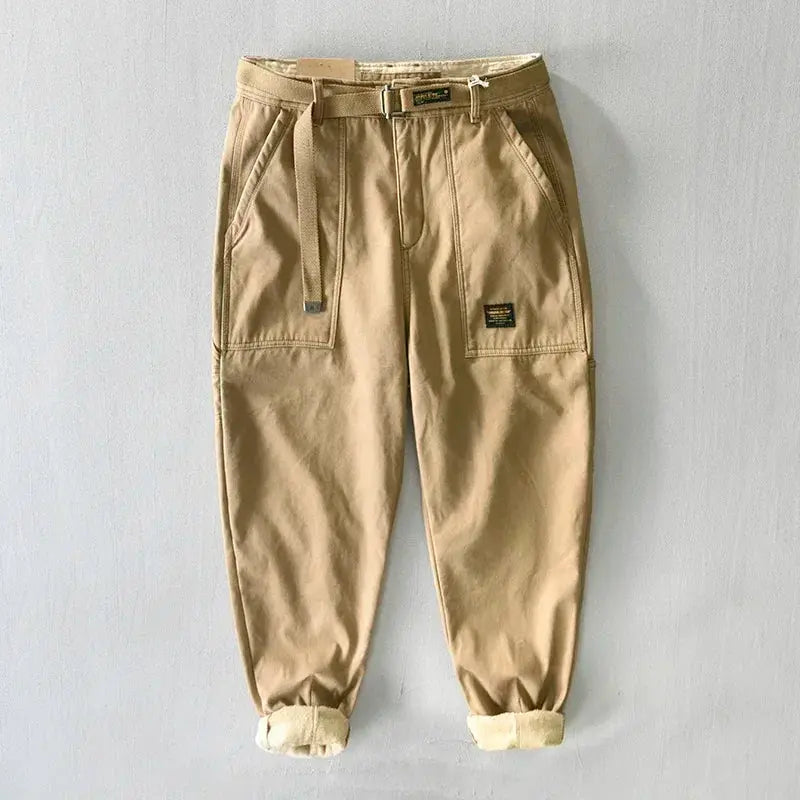 Khaki cotton cargo pants for men with belt, cargo pockets and rolled cuffs.