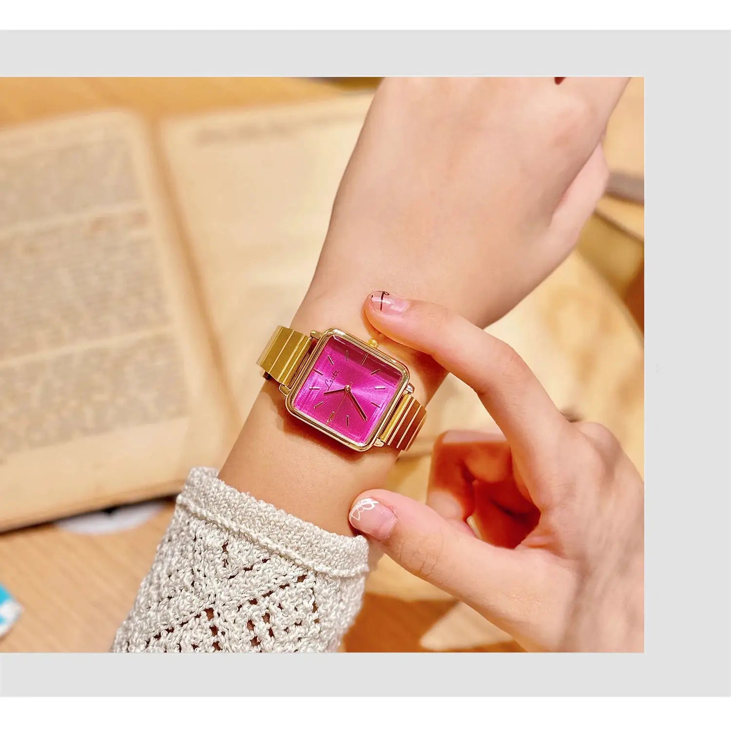 Women's gold-tone square-face watch with stainless steel bracelet and pink dial