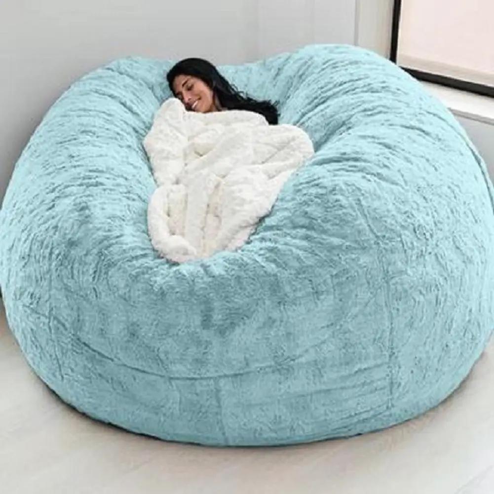 Giant blue plush bean bag sofa bed by Simples Market with soft fur-like upholstery