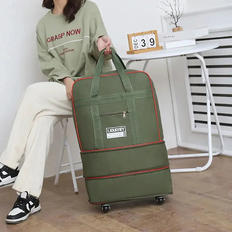 Folding travel bag by Simples Market, olive green with red trim, wheeled luggage