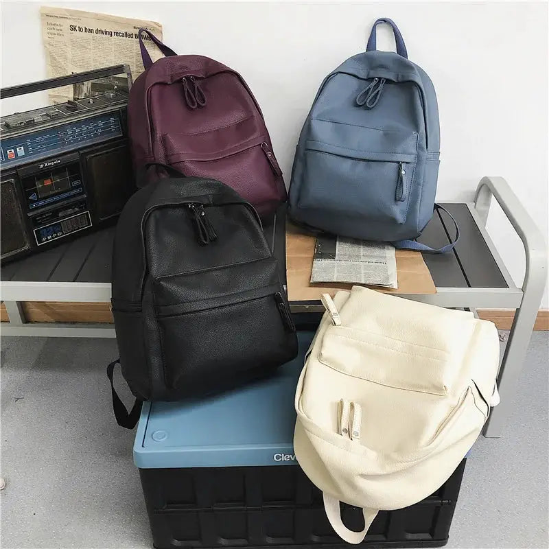 HOCODO PU leather fashion backpacks set in black, burgundy, blue, and cream with front pockets.