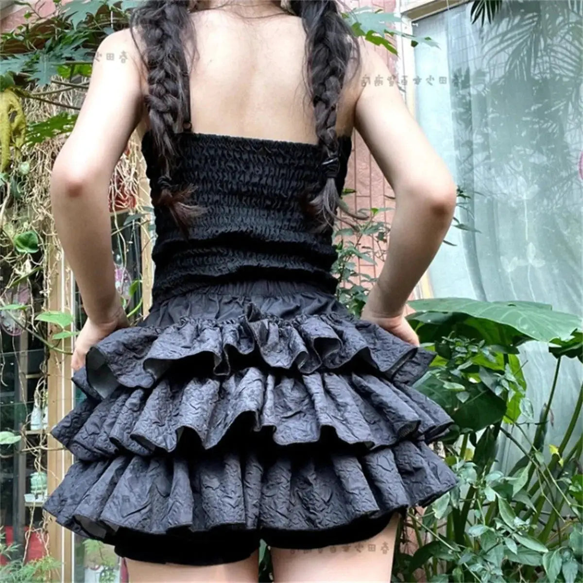 Simples Market Kawaii black layered mini cake skirt with elastic waist and ruffled tiers, back view