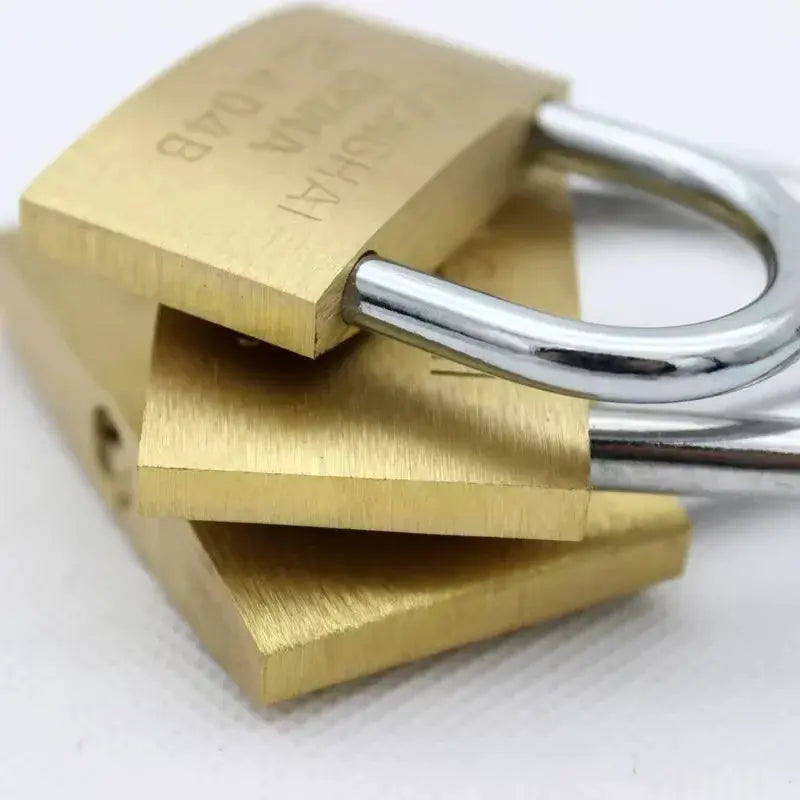 Brass padlock set with three small locks and silver shackles