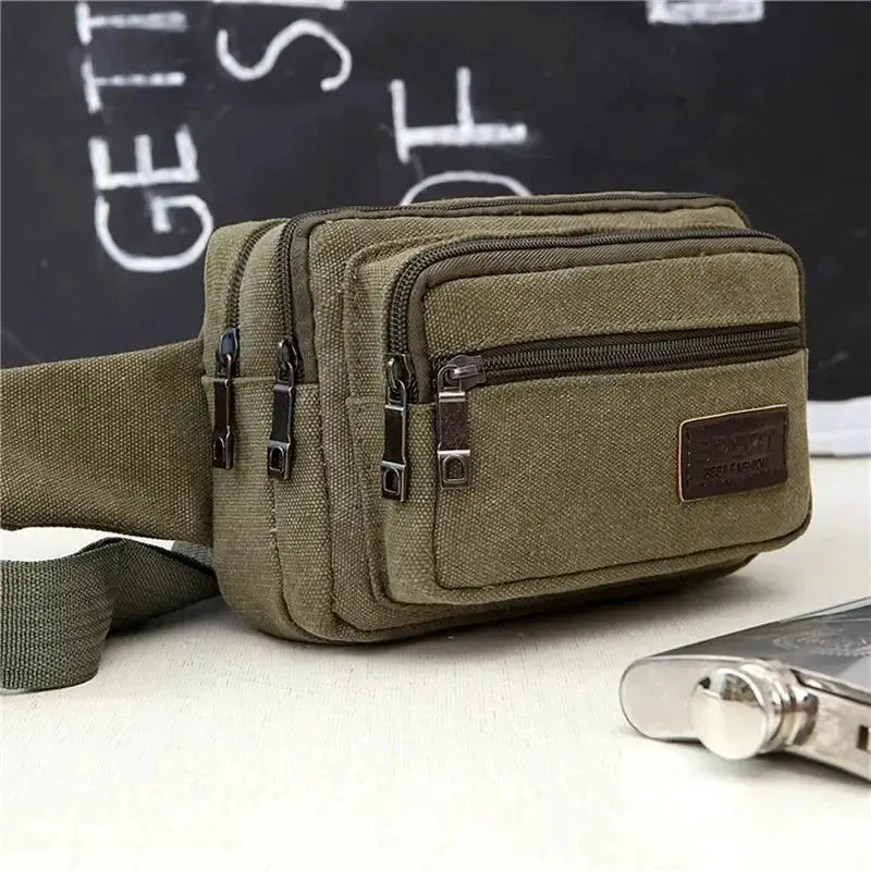 Simples Market canvas waist bag in olive green with multiple zip pockets and an adjustable strap