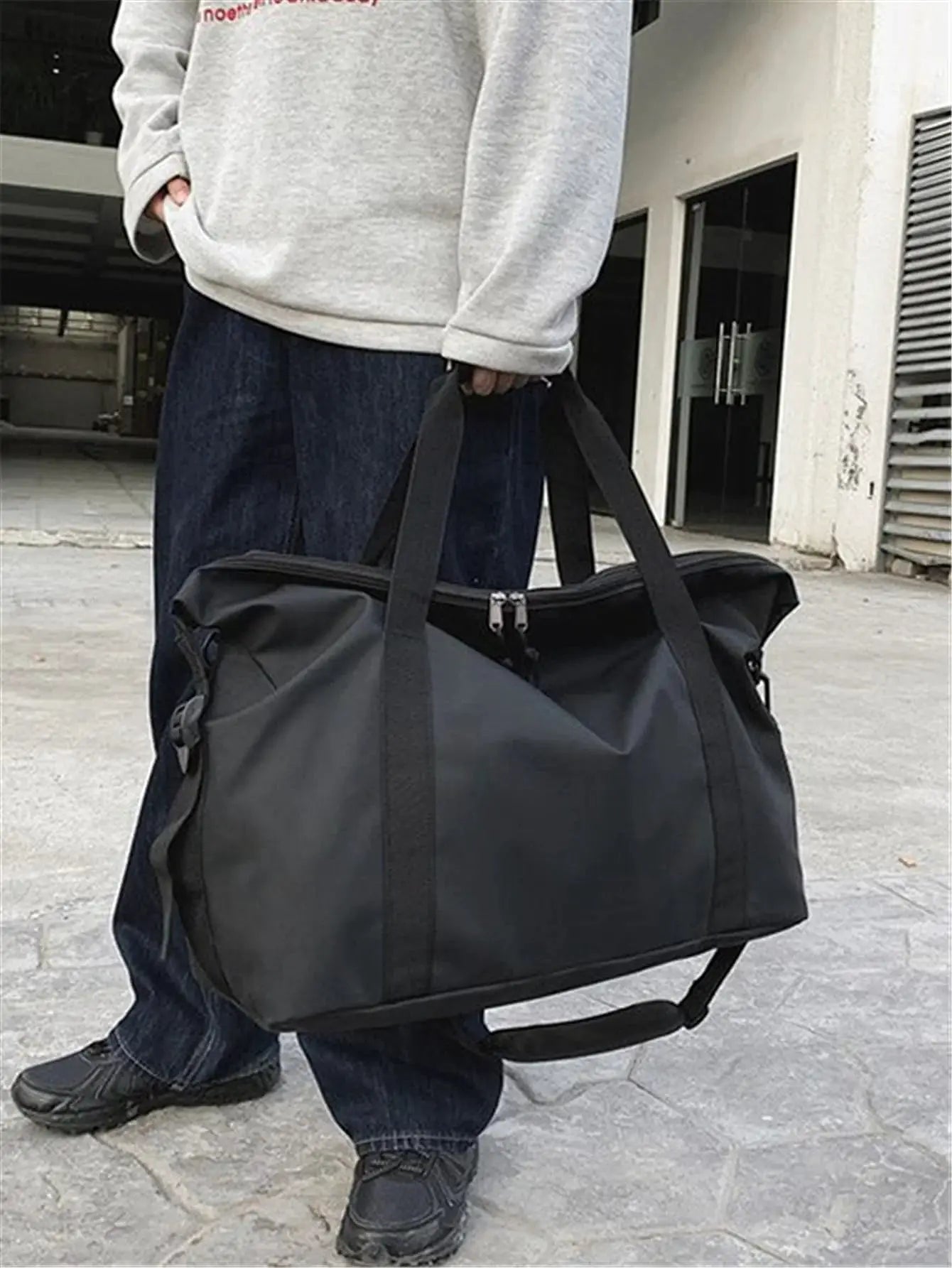 Simples Market handheld travel bag, black nylon duffel with top handles and crossbody strap