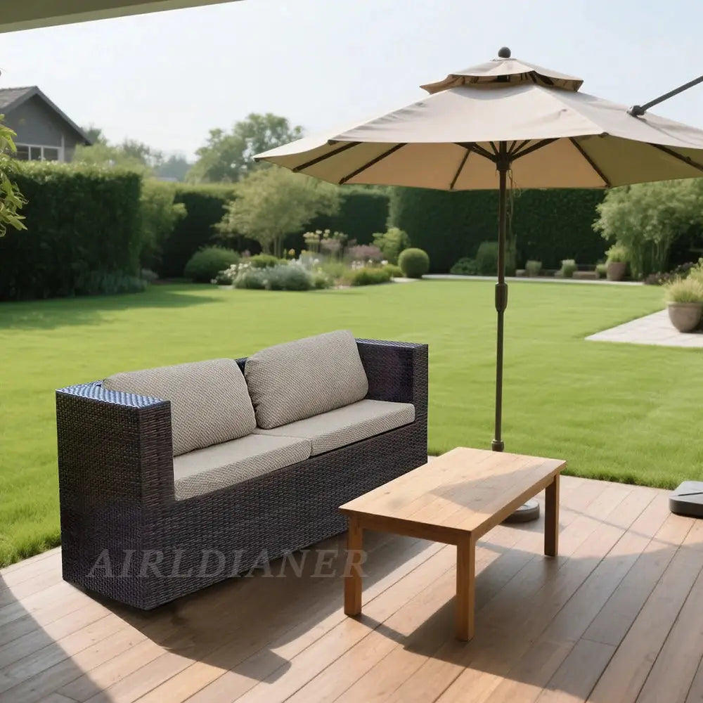 Twill Jacquard patio sofa cover by Simples Market on a dark wicker outdoor sofa with beige cushions under an umbrella.