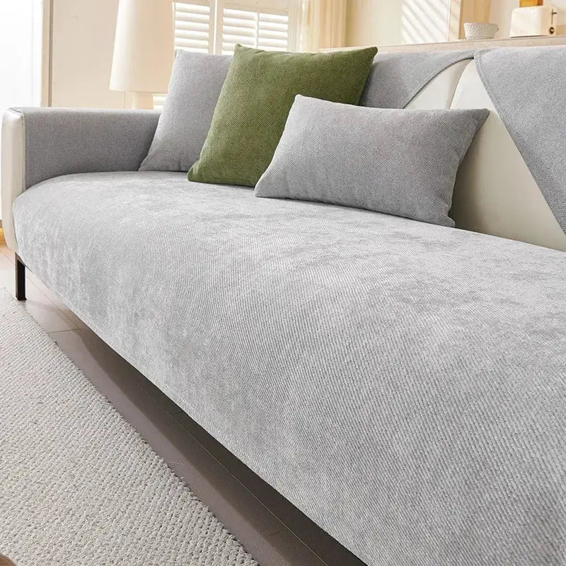 Solid gray chenille sofa cushion cover on a light sofa with green accent pillow and gray cushions