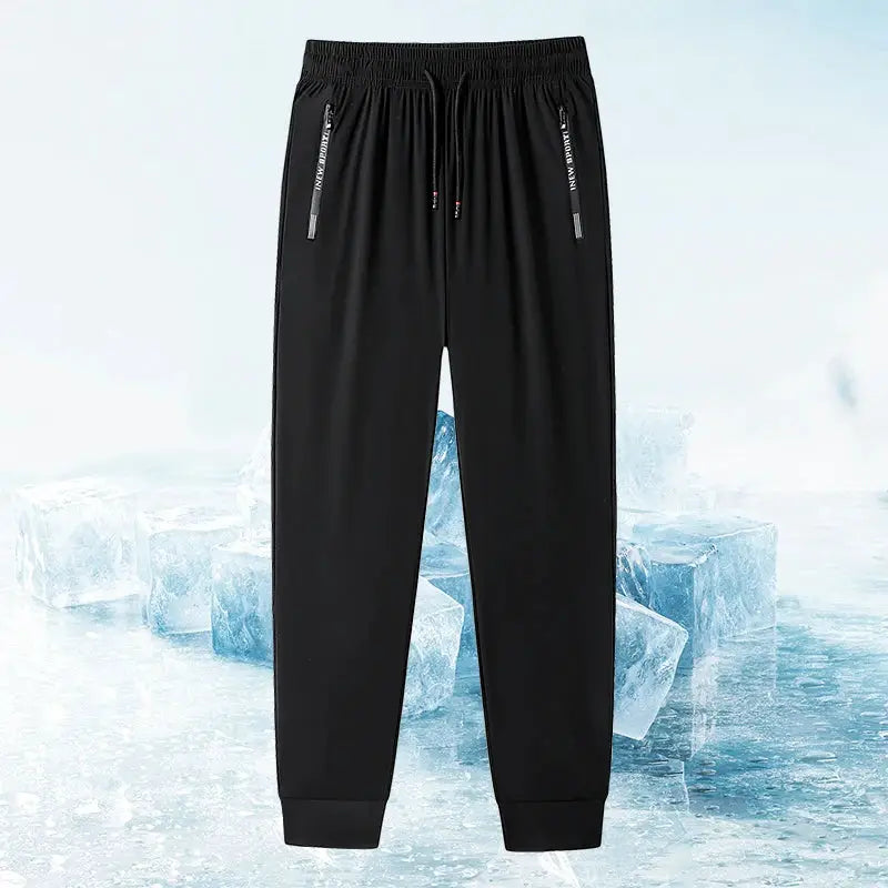 Men's black jogger pants with zippered pockets, elastic waist, stretch fabric by Simples Market