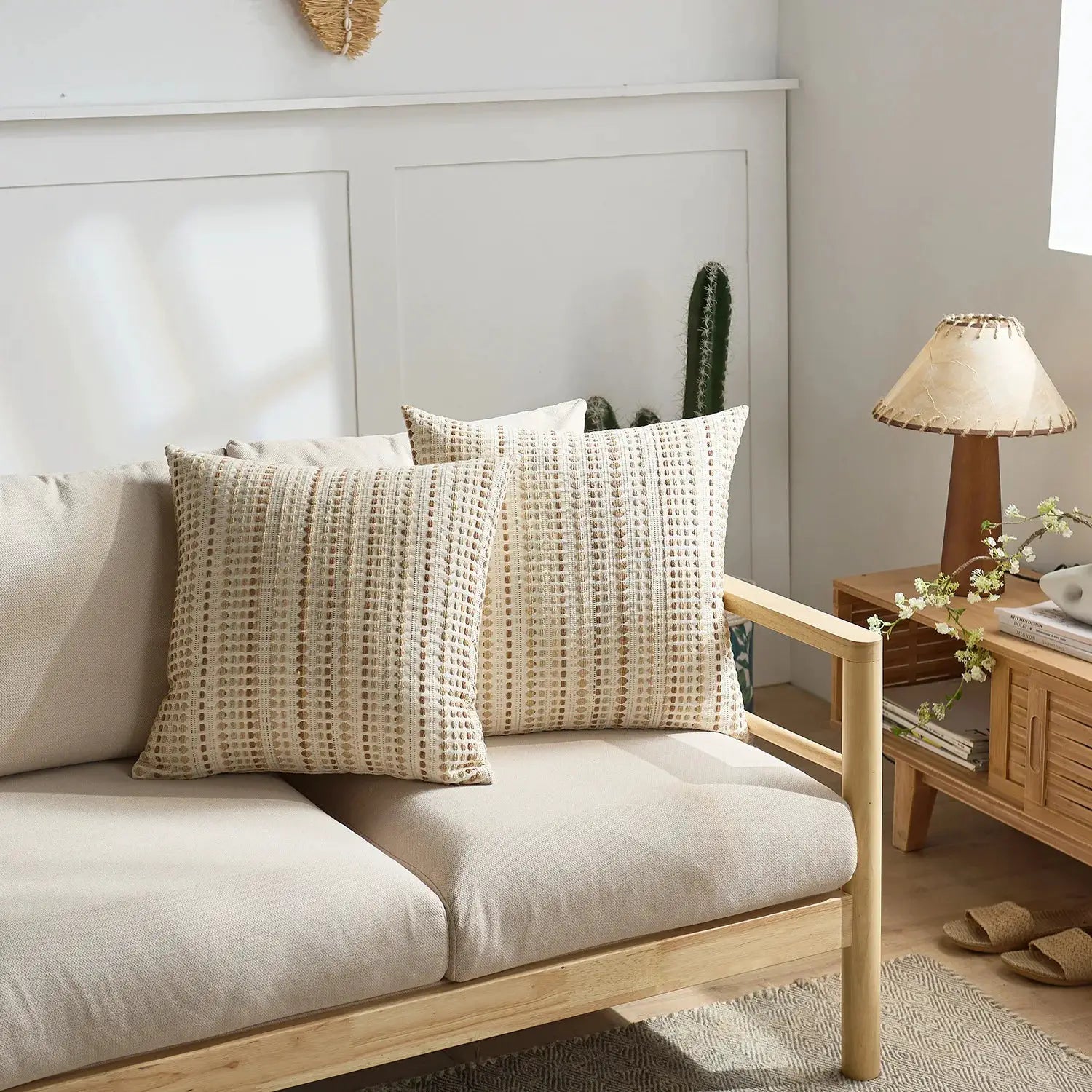 Boho Dots Jacquard cushion cover 45x45cm on beige sofa; ivory and brown dotted striped pattern