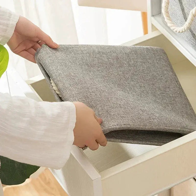 Folding linen storage basket in gray with handle by Simples Market for underwear, socks, and toys