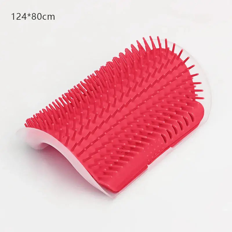 Pink silicone cat massage brush with curved design and dense bristles for grooming