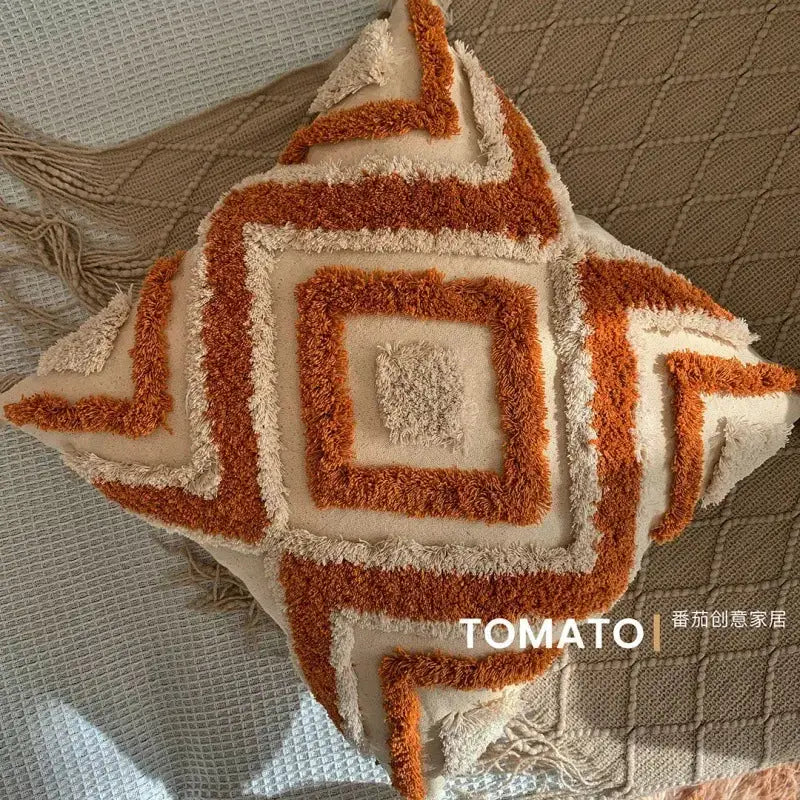 Bohemian pillow cushion cover with geometric tufted embroidery in rust-orange and cream, tassel trim, Tomato watermark