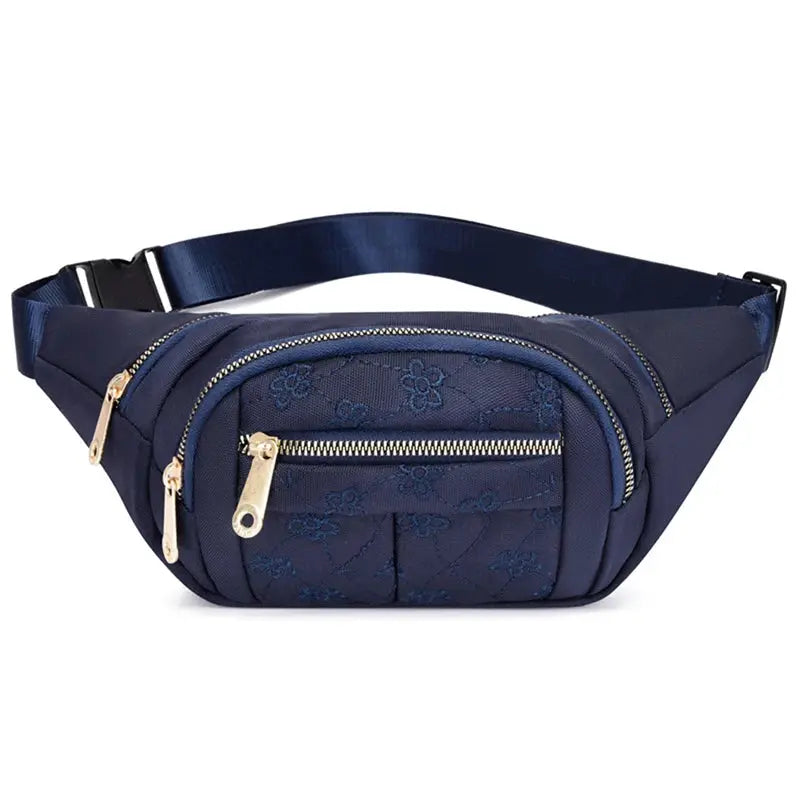 Women's waist bag in navy Oxford cloth with gold-tone zipper pockets and an adjustable belt strap.