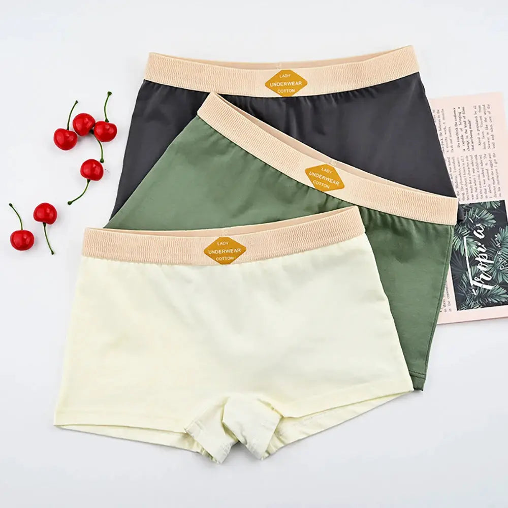 Women's 3-pack breathable cotton boxer shorts in cream, olive, gray with beige elastic waistband.