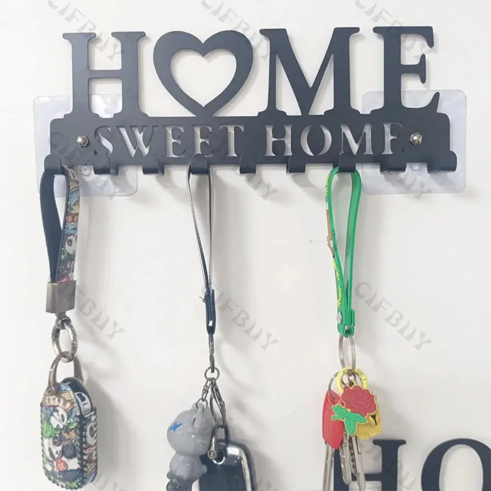 Metal wall hook key holder by Simples Market with three hooks and HOME SWEET HOME cutout decor