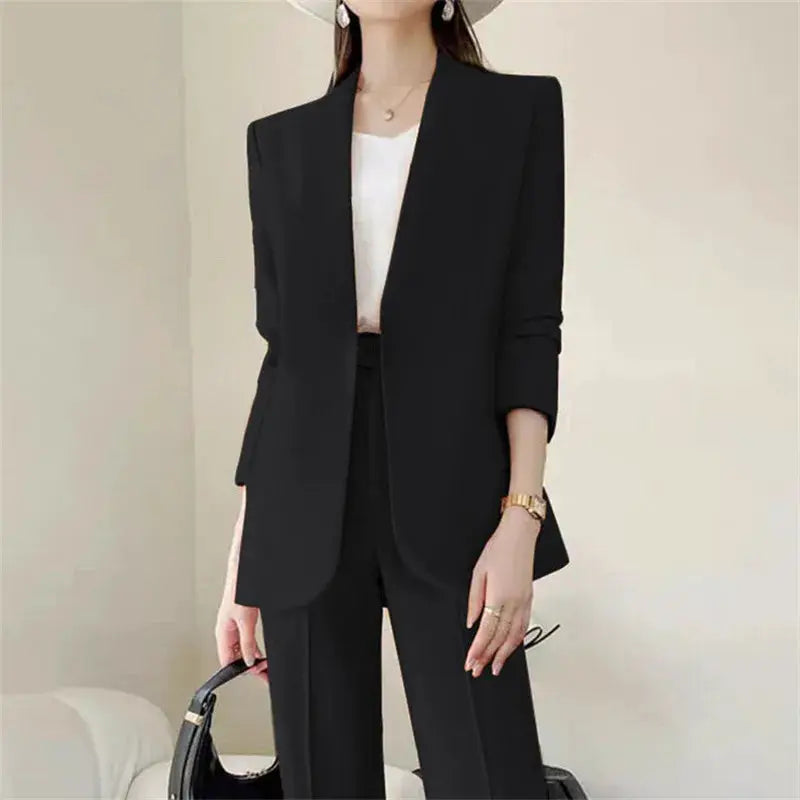 Black two-piece women's suit set (blazer + trousers) by Simples Market, shown with a white top.