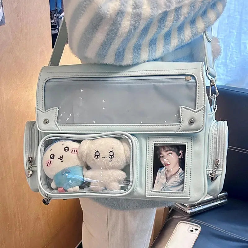 Simples Market Y2K ita bag in pastel mint with clear pockets, two plush toys, and a photo frame pocket