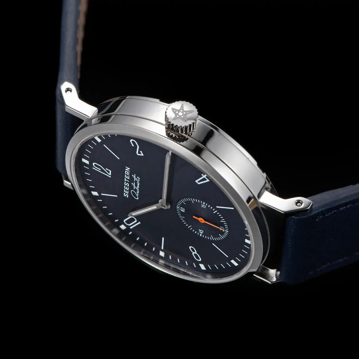 SEESTERN men's automatic wristwatch with navy dial, silver stainless-steel case, and blue leather strap.