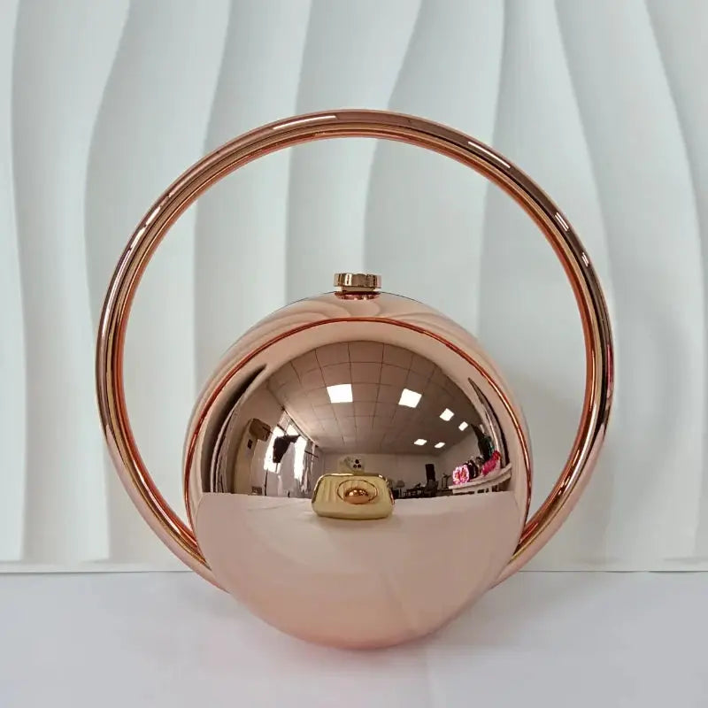 Rose gold acrylic evening clutch with circular ball handle by Simples Market, a luxury handbag for weddings and parties.