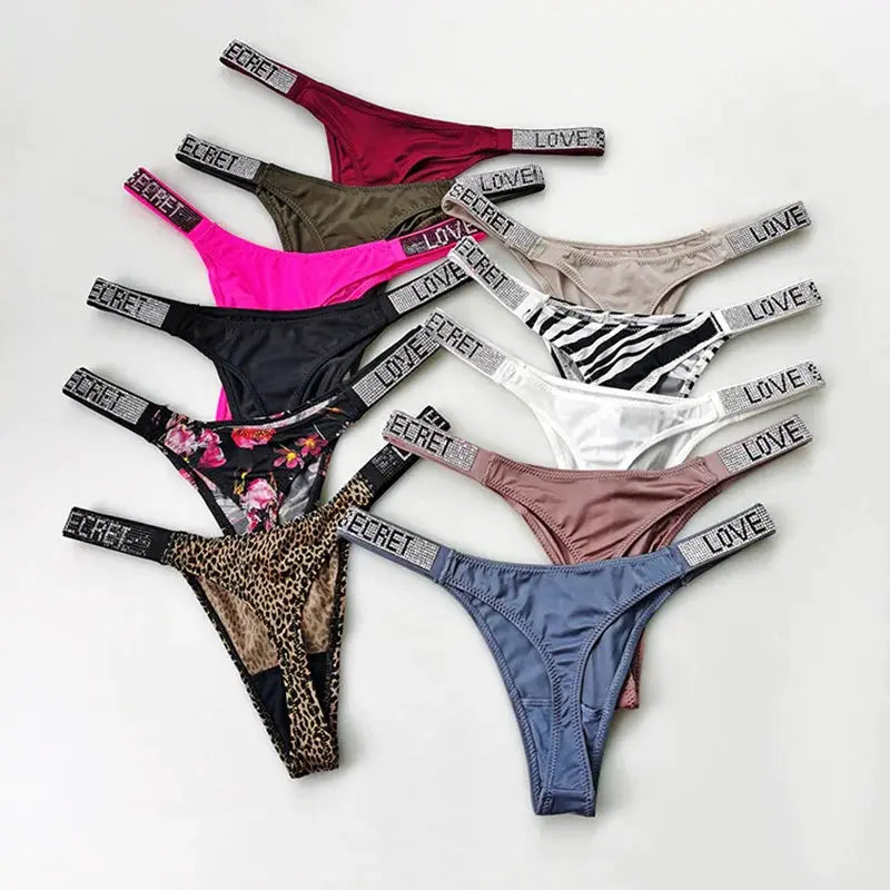 5-pack low-waist thong panties with rhinestone letter accents in assorted colors, T-back design