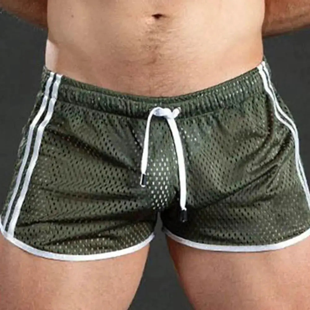 Men's olive green quick-dry mesh gym shorts with white trim and drawstring waist.