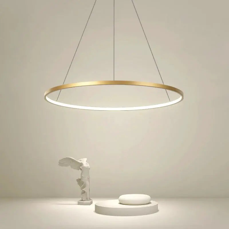 Modern round LED pendant light with a gold ring and white illuminated inner ring, ceiling-hung