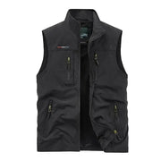 Sleeveless cargo vest; black outdoor vest with multiple zip pockets and front zipper.