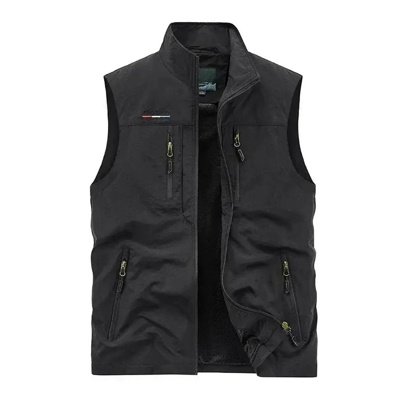 Sleeveless cargo vest; black outdoor vest with multiple zip pockets and front zipper.