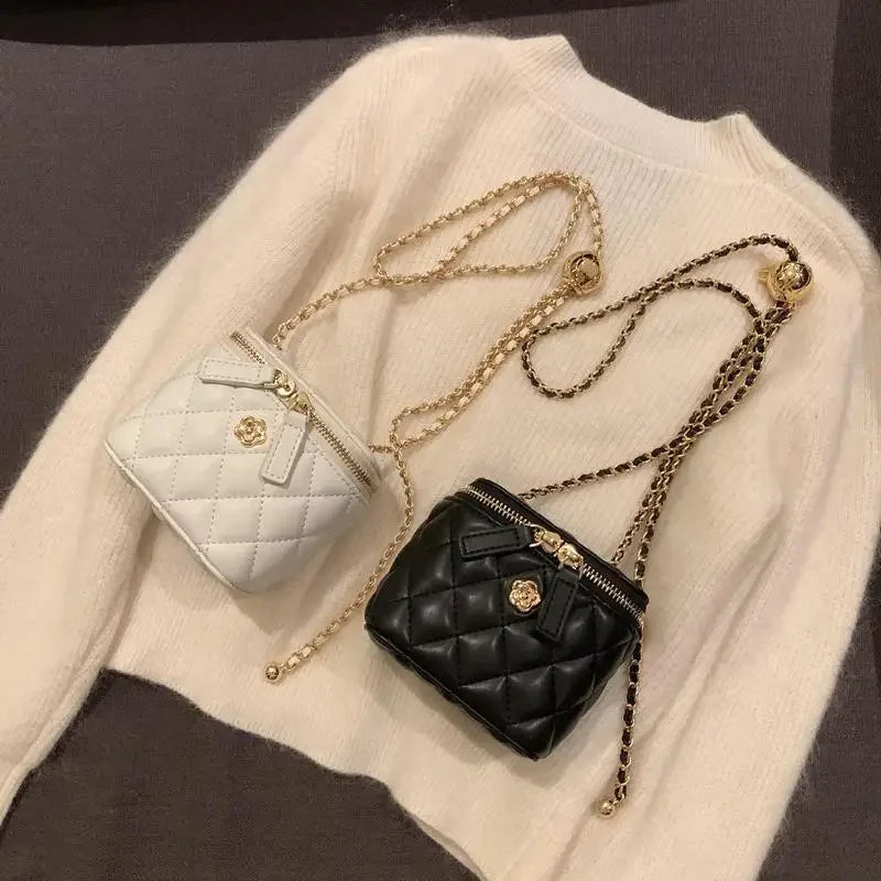 Mini quilted shoulder bags by Simples Market, white and black with gold chain straps, two bags