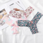 Women's floral lace thong underwear set, seamless G-string, four pieces in pink, blue, teal and multicolor.